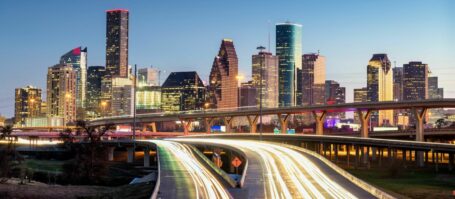 Houston, Texas, USA downtown skyline over the highways at dusk.